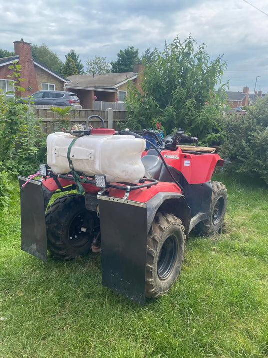 Red ATV with liquid tanks and mud flaps.
