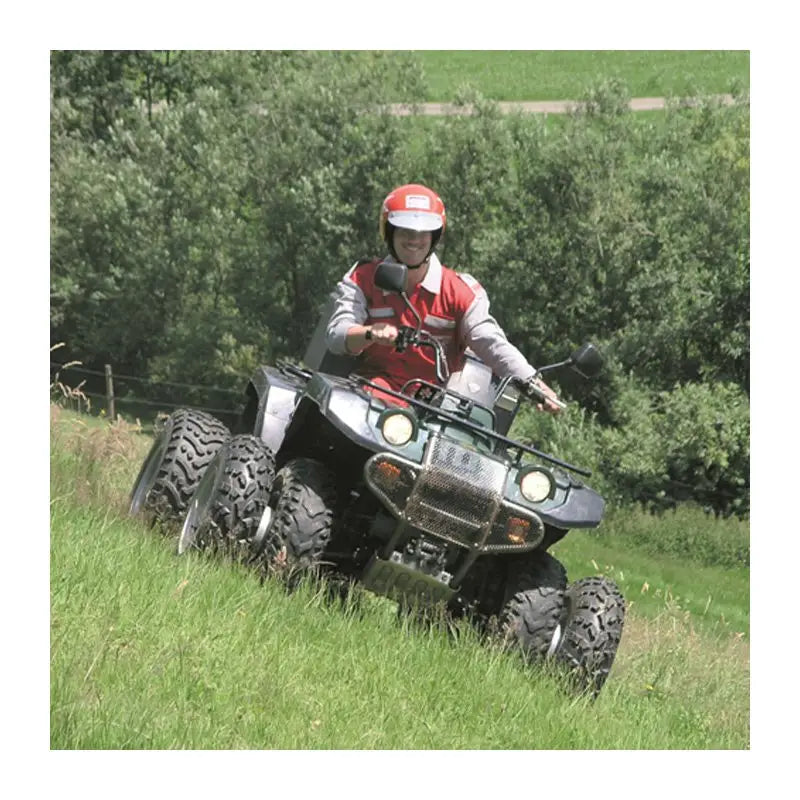Gray and black six-wheeled ATV with driver in red and white helmet and vest in ATV QUAD Dual Wheel Spacer Kits collection