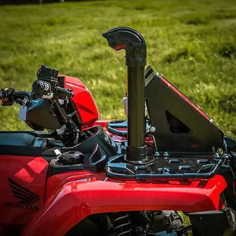 Red Honda all-terrain vehicle with snorkel and front rack in Highlifter Honda ATV collection