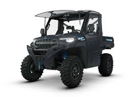 Dark gray Polaris Ranger 1000 two-person off-road utility vehicle with roof and doors