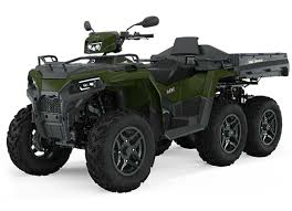 Six-wheeled olive green Polaris Sportsman 6x6 utility ATV with cargo racks