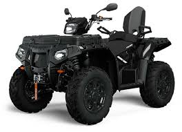 Dark-colored Polaris Sportsman Touring 1000 all-terrain vehicle with headlights and sturdy tires