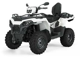 White and black Polaris Sportsman Touring 570 all-terrain vehicle with four large tires