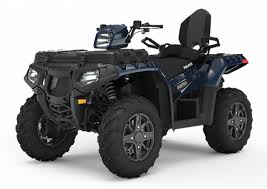 Dark blue Polaris Sportsman Touring ATV with two seats and large knobby tires
