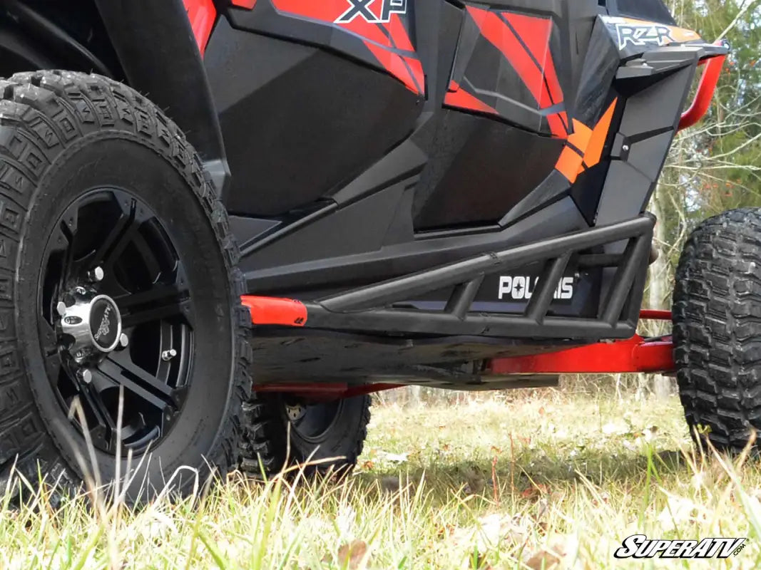 Black and red off-road UTV with protective side rails from SuperAtv Rock Sliders collection