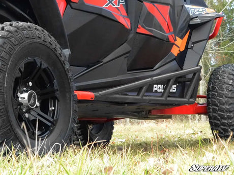 Black and red off-road UTV with protective side rails from SuperAtv Rock Sliders collection